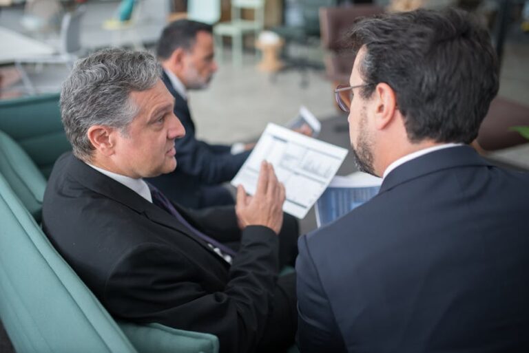 Businessman meeting with carbon emission reduction specialist in London.