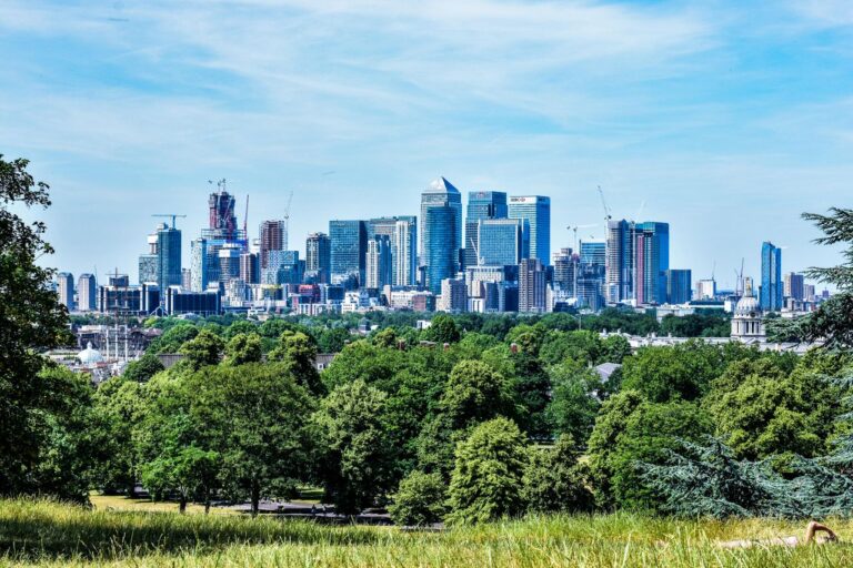 Stunning view of London skyline with greenery from Greenwich Park.